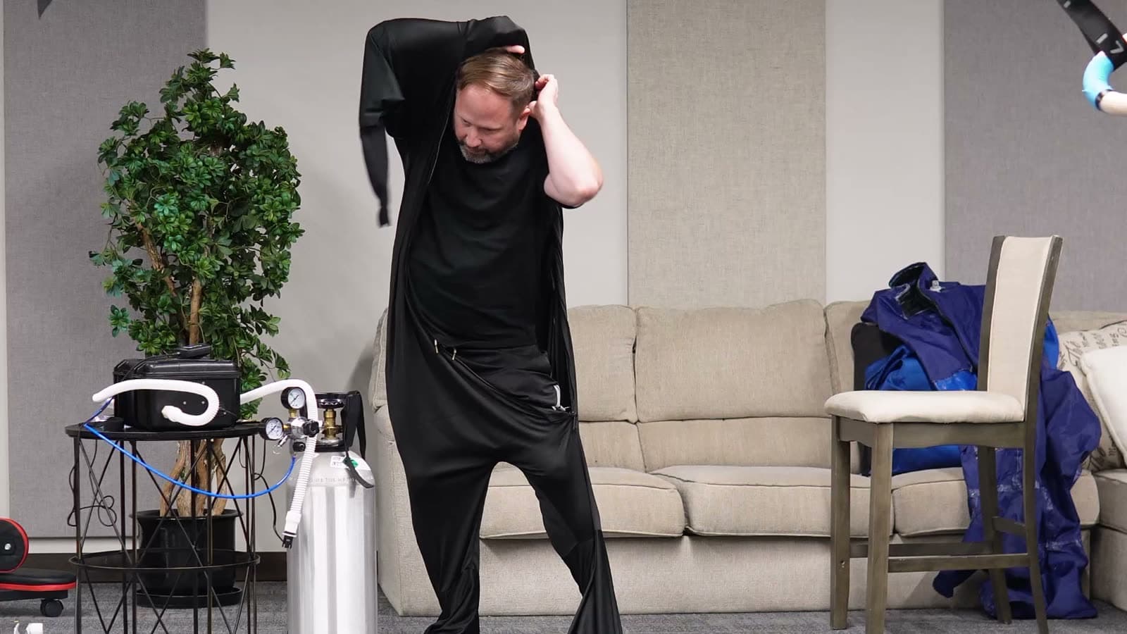 Putting on the inner suit head first