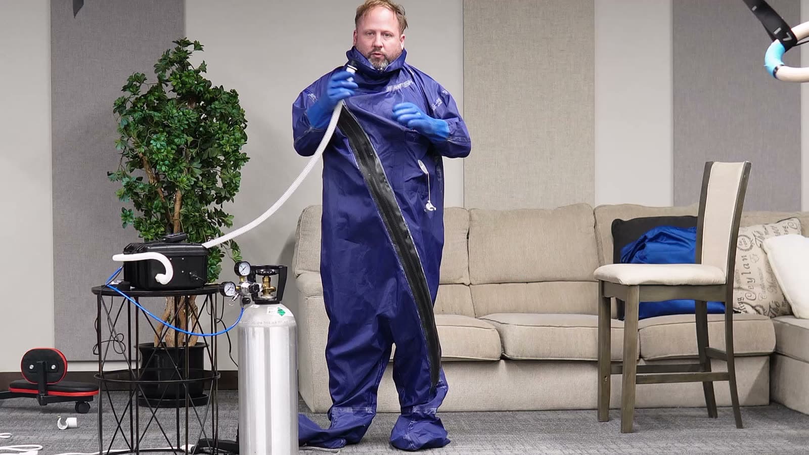 Zipping up and attaching the white hose